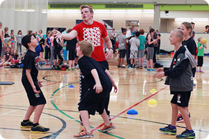 CBE students receiving handball instruction from Canadian athlete